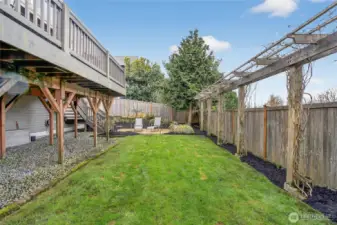 Large, level yard w/ lush green lawn & patio space.