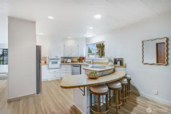 The kitchen with its new appliances is waiting for you. Eat at the bar, or just entertain the cook.