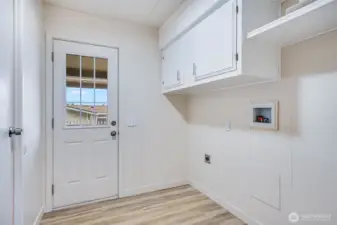 The roomy utility space has room for a full size washer and dryer.