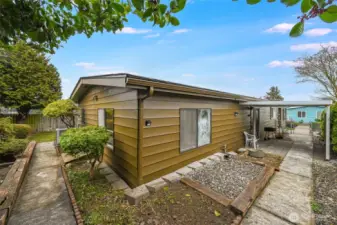 The yard has spaces that can be used for planting brush and flowers or be used to grow your own vegetables.