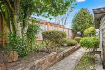 The back yard is organized and have room for adding spring colors.