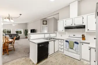 Kitchen with breakfast bar, dining area and family room