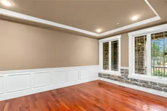 Beautiful formal living room with custom built-in cabinets and shelving, highlighted by detailed millwork craftsmanship.