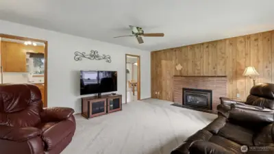 Bright living room with cozy gas fireplace.