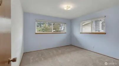 One of three spacious bedrooms.