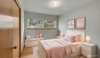 Second bedroom offers hardwood floors.