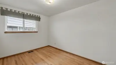 Third bedroom offering hardwood floors.