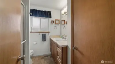 Full bath with linen closet.