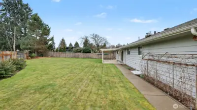 Large fully fenced backyard.