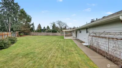 Large fully fenced backyard.