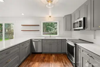 New cabinets, appliances, counters, window, lighting and paint