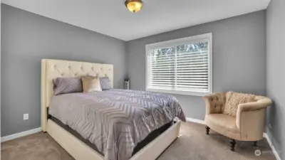 Upstairs guest room with tons of natural light.