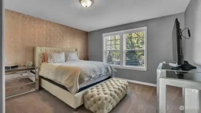 Third upstairs bedroom with elegant wallpaper.