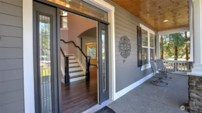 Stunning covered porch is the perfect place to sit and enjoy this quiet neighborhood.