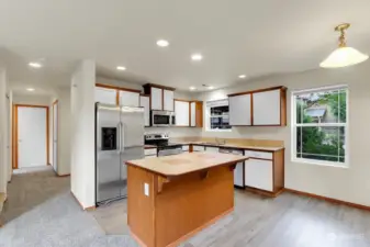 Kitchen with Center Work Island, Stainless Appliances & Eating Area