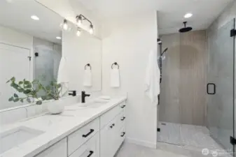 Photos of staged unit, 20313A. Walk-in shower with rain can showerhead and glass enclosure