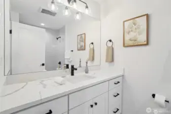 Photos of staged unit, 20313A. Level 3 common bath