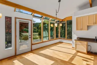 The views and natural light continue in the sunroom style nook off of the kitchen.