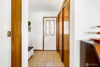 When you enter through the front single door, put your coat and shoes into the large coat closet in the tiled entryway.  Have a seat on the bench for ease of putting on and taking off your summer sandals.