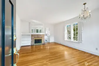 You will be greeted by gleaming hardwood floors...