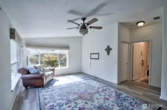 Family room has two grand picture windows.