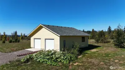 New two car garage with storage and extra doors is set up for future ADU with power already in.