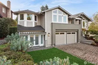 Home was enlarged by previous owner to include a 3rd large garage storage space with French doors and connects to main garage spaces.