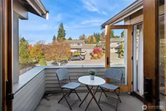 Private balcony deck has waterproof decking and shares the access with the primary bedroom. The deck overlooks the entry porch and front yard and has territorial viewpoint.