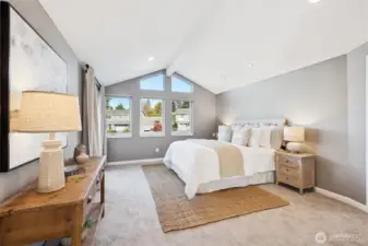 with vaulted beam ceiling, abundant windows for natural light, double glass French doors to the private balcony deck on northwest side of the room.