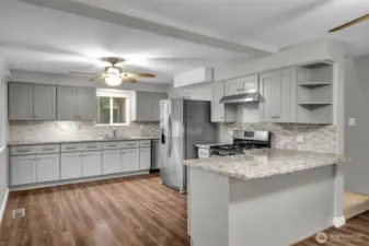 Roomy kitchen with lots of storage and breakfast bar.