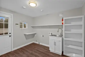 Laundry room on main floor with side door entry.