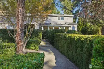 Privacy hedges line the walkway