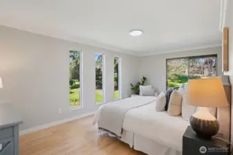 Primary Suite includes access to back deck and a wood burning fireplace