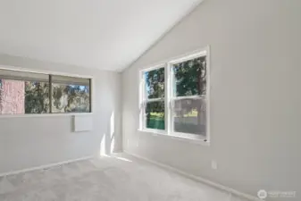 Light filled corner bedroom with walk in closet