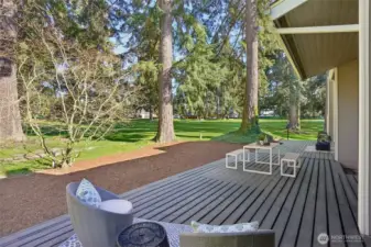 Private entertaining deck runs the full length of house accessible from family room, formal living room, and Primary suite