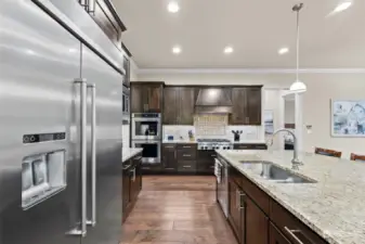 Gourmet Kitchen also features matching stainless steel Kitchen Aid appliances.