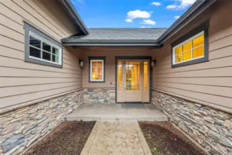 A charming covered front porch warmly welcomes you home, offering the perfect spot to relax and unwind.