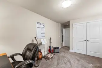 Another angle of the upstairs guest room highlights the spacious closet, providing ample storage for you or your guests.