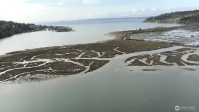Drone view from above property.  Note Sandy Hook community in the top left and shipping lanes above with the Olympic Peninsula across the water.