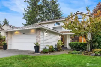 Large two car garage with built-in shelving and workbench. Plenty of room for your vehicles plus  extra storage space.