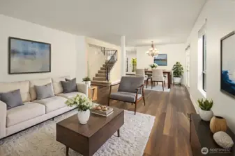 Large living room/dining room area with new interior paint and newer LVP flooring. This makes the perfect great room setting and includes french doors to the side deck and hot tub area. (Digitally staged)