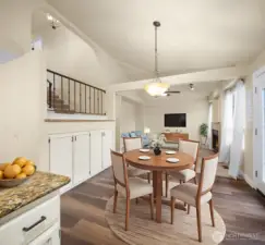 Extra room for casual eating area between the kitchen and family room with additional cabinets for extended pantry space. (Digitally staged).