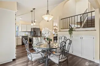 Tall ceilings, open staircase, and extra bonus cabinet space for expanded pantry or games/toy closet.