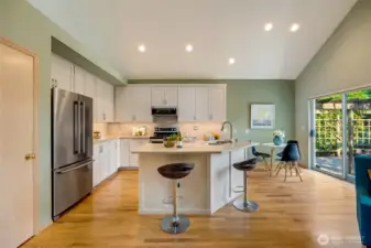 Updated kitchen with sliding door to large private patio.