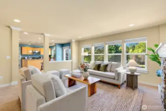 Open kitchen/ casual dining + den w/ fireplace