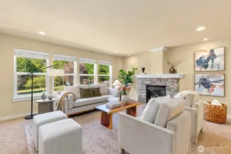 Open kitchen/ casual dining + den w/ fireplace
