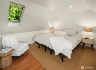 Primary bedroom with private bathroom and western water views and private balcony