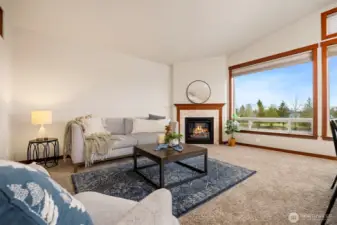 Back inside, you'll enjoy gathering around the fireplace, and panoramic views from any spot in the living room.