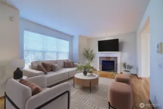 Cathedral ceilings in large living room surrounding gas fireplace