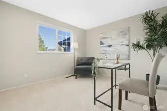 Third guest room staged as a home office to show off the room flexibility.